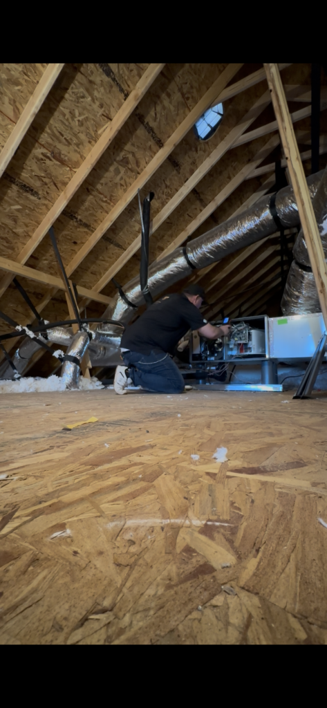 Attic insulation and HVAC ductwork checked during a home energy assessment in Oklahoma City