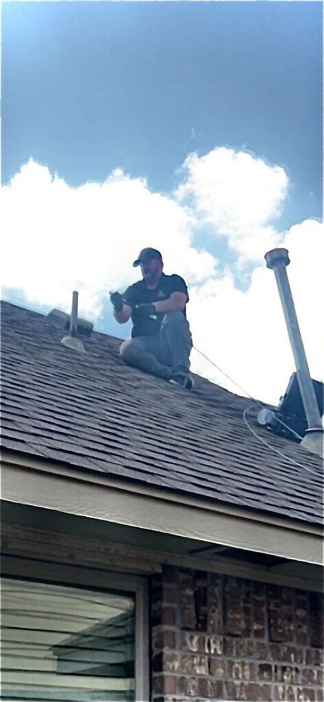 Oklahoma City inspector running a sewer scope camera down the roof plumbing vent